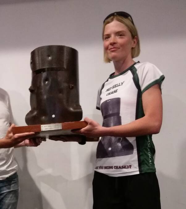 Tash Fraser with the suitably designed Ned Kelly Chase trophy