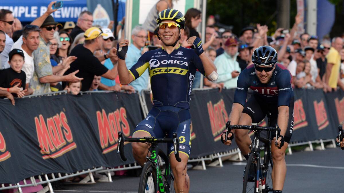 Caleb Ewan gives a victory salute in this year's Cycling Australia road national criterium championship in Sturt Street, Ballarat.