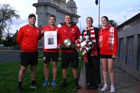 Ballarat senior football and A grade netball leaders Andrew Hooper, Chris Maple, Keegan Mellington, Erin Richardson and Brooke O'Brien paid tribute to Swans champion Max Wheeler at the Arch of Victory in the lead-up to Anzac Day. Picture by Adam Trafford. 