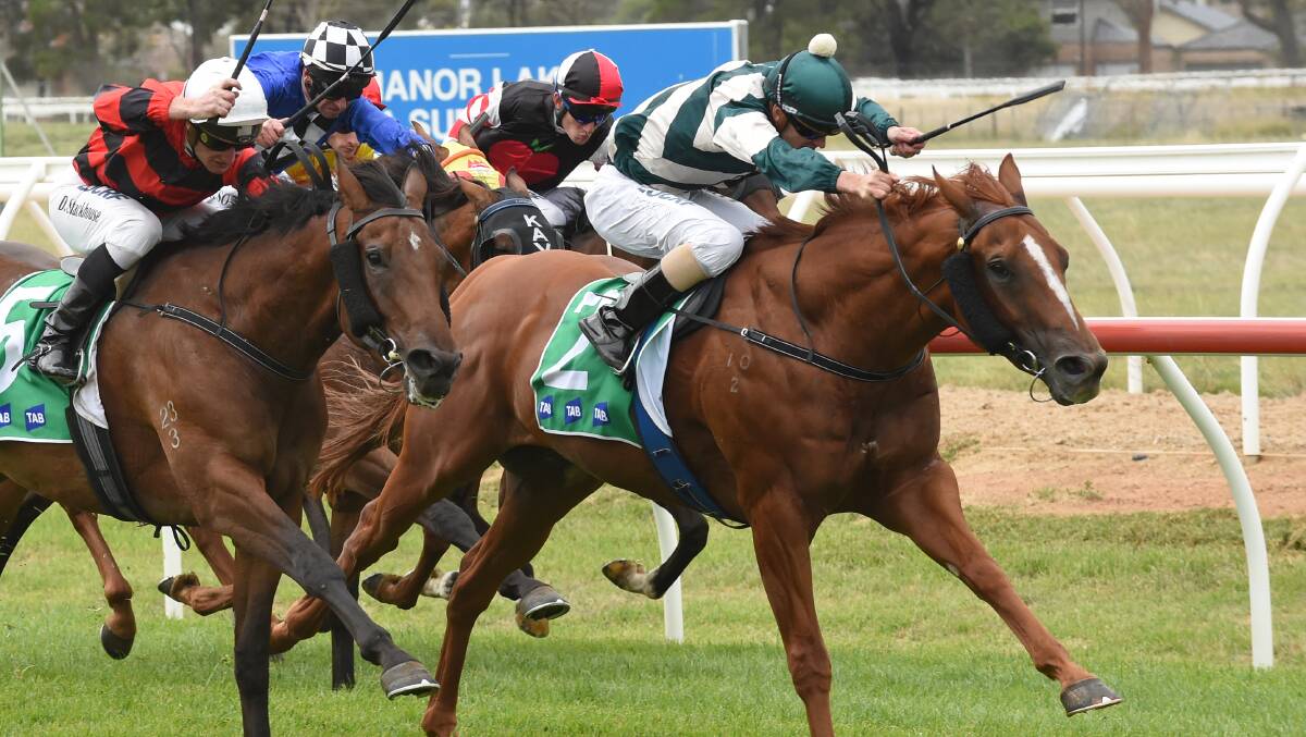 CHARGING HOME: He's Our Woody, ridden by Jason Benbow, wins a maiden for trainer Andrew Payne at Werribee. Picture: Getty Images