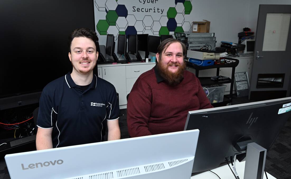 Federation TAFE lecturer Dr Adam Bignold and Certificate IV in Cyber Security student Samuel Finch. Picture by Kate Healy
