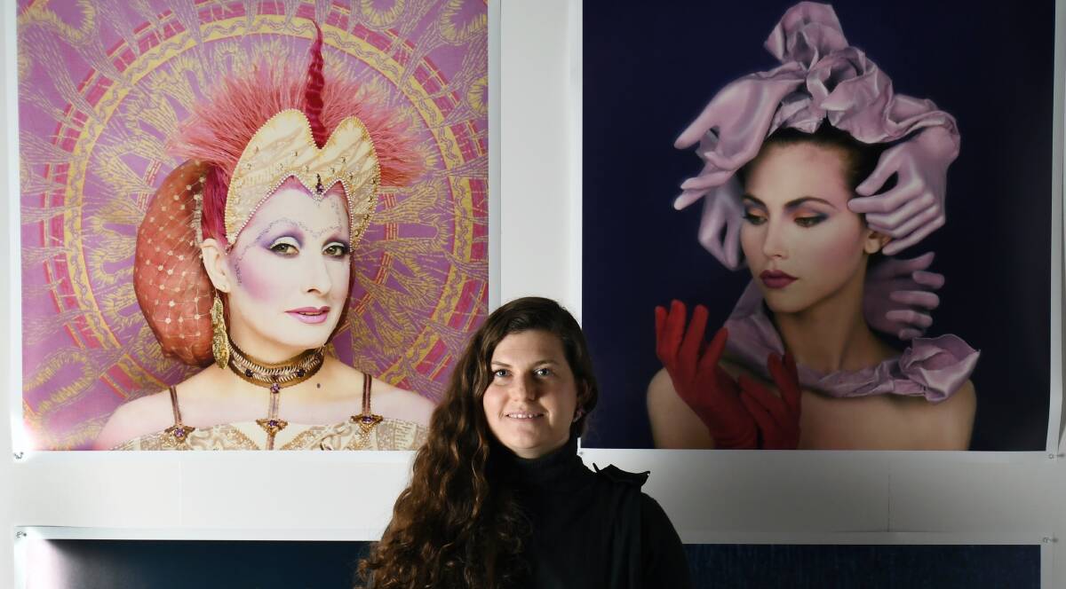FASHION EXPOSED: Curator Michelle Mountain with the faces of fashion photography from her BIFB exhibition Reverie Revelry. Picture: Kate Healy