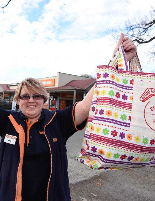 REUSABLE BAGS: Sam Blanchard shows off reusable Boomerang cloth bags that shoppers can use to replace plastic bags. Picture: Lachlan Bence