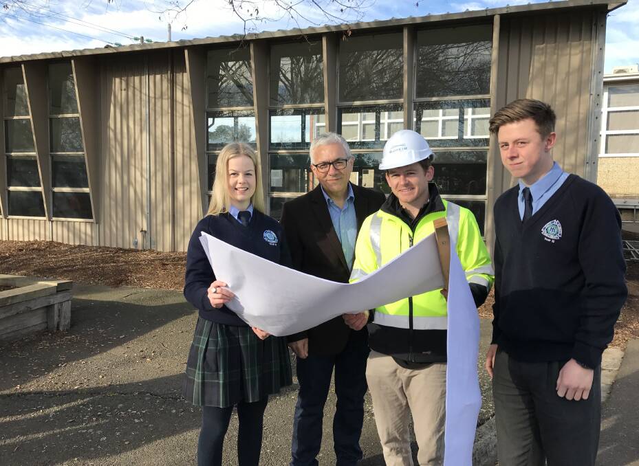CHANGES: Millie Bilson, architect Nick Marino, builder Cole Roscholler and Nick Winters check out plans for the new buildings at Ballarat High School. Picture: Michelle Smith