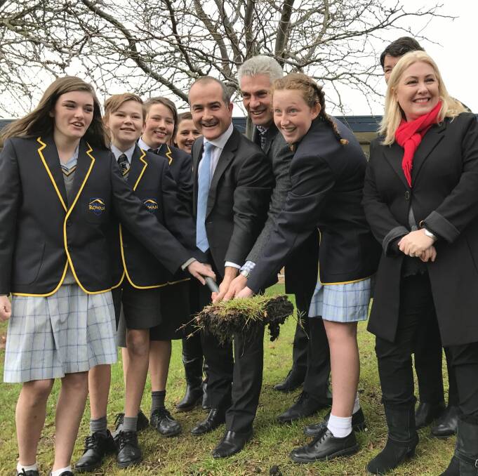 SOD TURNING: Education minister James Merlino turns the first sod of construction at the Mount Rowan campus with Ballarat Secondary College principal Rick Gervasoni, Wendouree MP Sharon Knight and year eight students. Picture: Michelle Smith