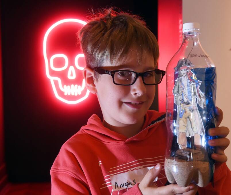 PIRATE: Angus shows off his pirate in a bottle, made during a school holiday workshop at the Art Gallery of Ballarat. Picture: Jeremy Bannister