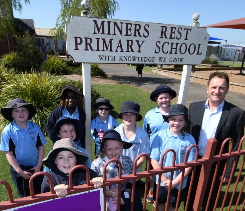 SQUEEZED: Miners Rest Primary School pupils and principal Dale Power are feeling the pressure of rising enrolments and reduced ground space. Picture: Lachlan Bence