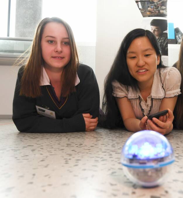 ROBOTICS: Hayley-rose Ruddick learns about sphero robotics from Ballarat Tech School ambassador and tech entrepreneur Marita Cheng. Picture: Lachlan Bence