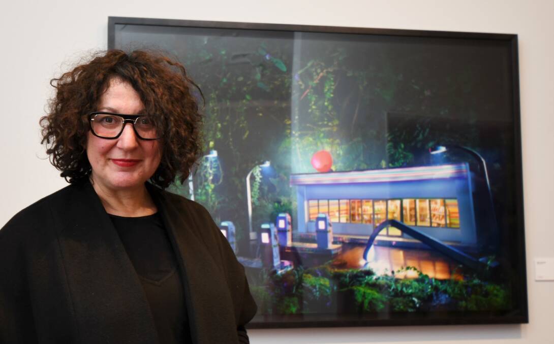 LACHAPELLE: BIFB director Fiona Sweet with one of the works from the David LaChapelle retrospective at the Art Gallery of Ballarat. Picture: Lachlan Bence