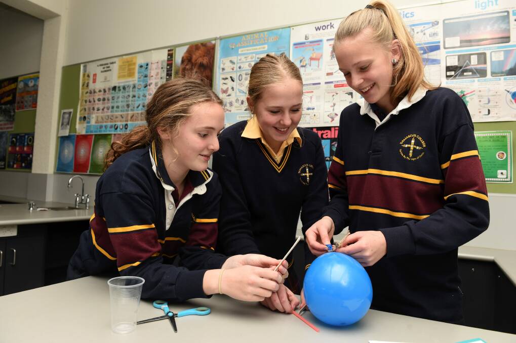 PROBLEM SOLVING: Damascus College students Mia, Courtney and Madi consider novel solutions to real-world problems using basic materials. Picture: Lachlan Bence