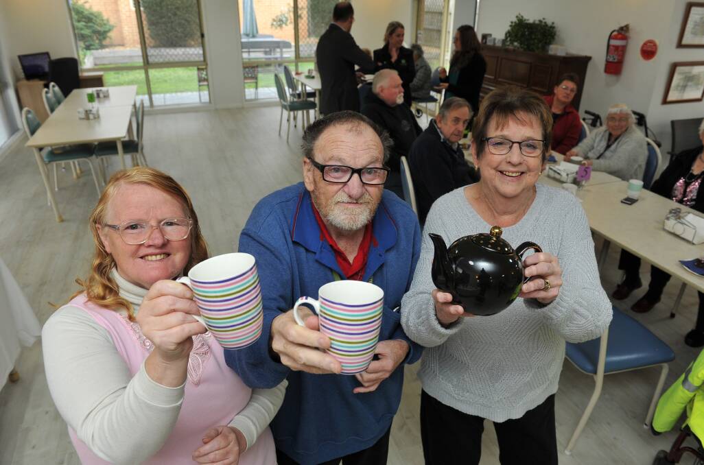 TEA TIME: Sovereign Gardens residents Annette Wieghtman, Wesley Kinnersly and Val Squire take tea for three yesterday as part of the Cancer Council's Australia's Biggest Morning Tea fundraiser. Picture: Lachlan Bence.