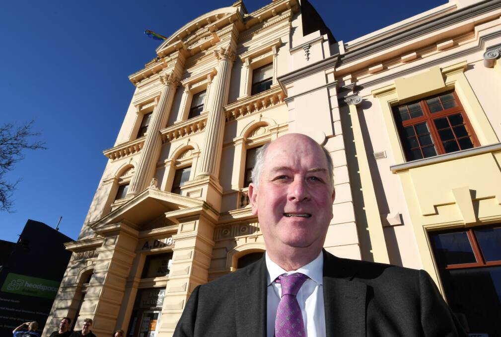 RESTORATION: Planning minister Richard Wynne outside Ballarat Trades Hall after announcing $200,000 funding to help restore the building's crumbling facade and return it to its original state. Picture: Lachlan Bence