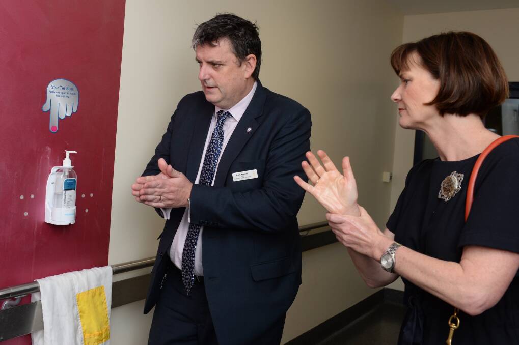 GERM FREE: Ballarat Health Services chief executive Dale Fraser and Victorian State Cabinet Secretary Mary-Anne Thomas wash their hands as they tour Ballarat Base Hospital's emergency department. Picture: Kate Healy