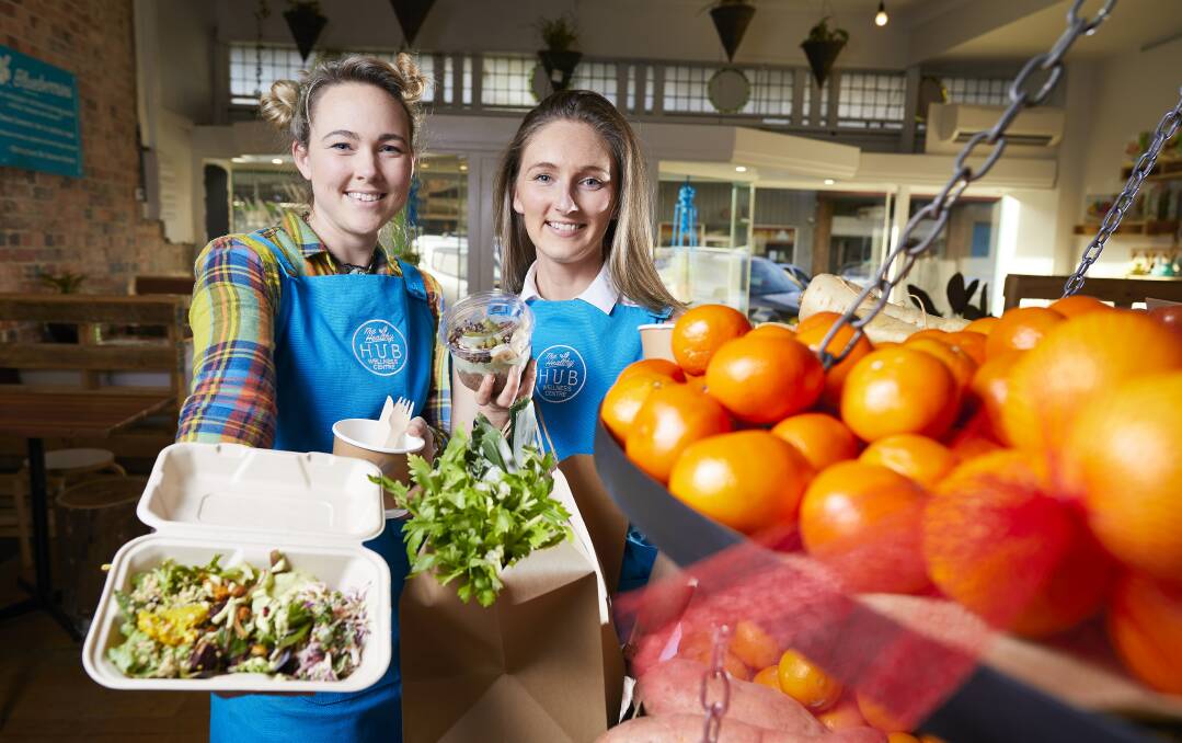 PLASTIC-FREE: Healthy Hub owners Brooke Byvoet and  Stacey Gibson in their new Bridge St cafe and wellness centre. Picture: Luka Kauzlaric