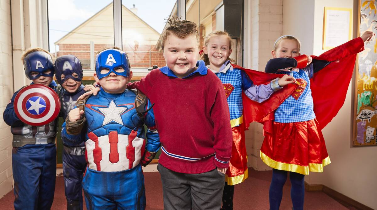 SUPER POWERS: St Francis Xavier pupils Isaac, Wentworth, Will, Max, Estella and Ivy are superheroes for Muscular Dystrophy. Picture: Luka Kauzlaric 