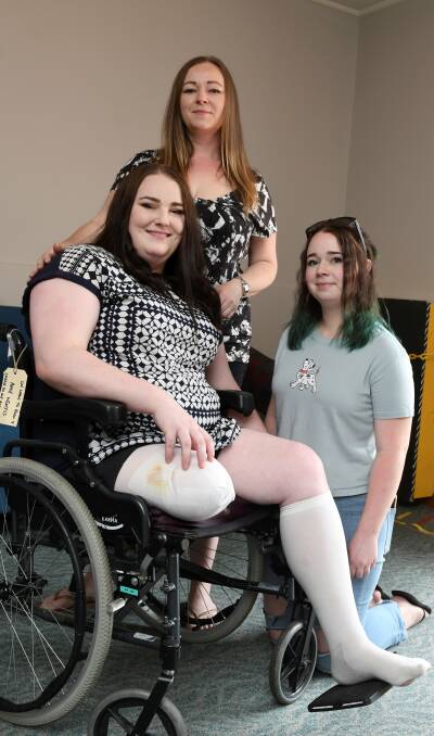 SLIP: Amie Wemyss with her sister Kate and niece Hannah Wemyss-Sanderson who started a GoFundMe campaign for a new prosthetic leg for Amie. Picture: Lachlan Bence