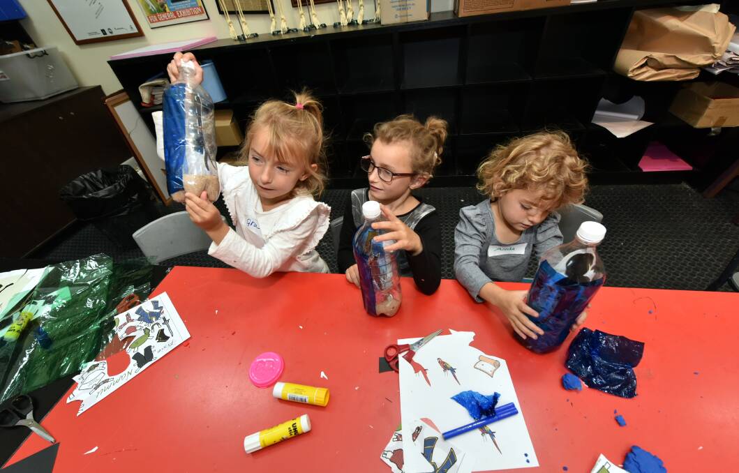 Gracie, Eleanor and Anika Downey creating their masterpieces during the Pirate In A Bottle school holiday art workshop at the Art Gallery of Ballarat. 