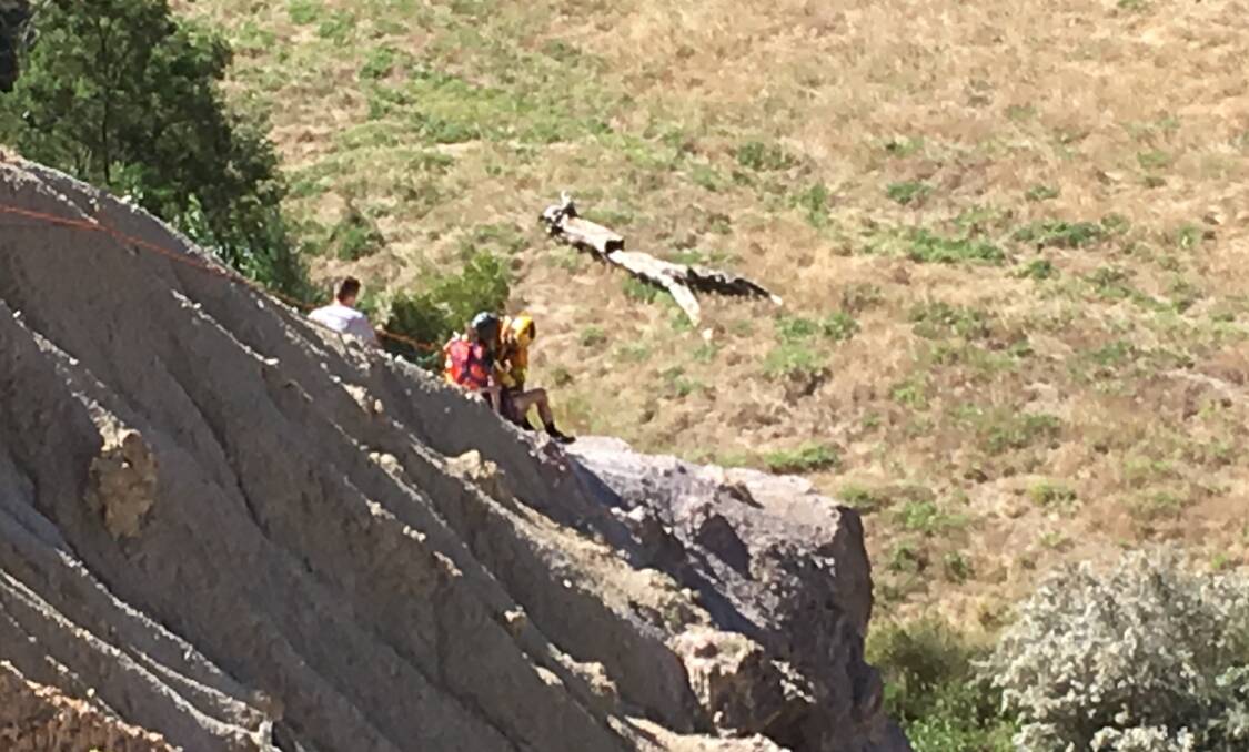 HELP: Ballarat CFA high angle rescue officers help the stranded boys up the cliff near Werribee Vale Rd, Bacchus Marsh