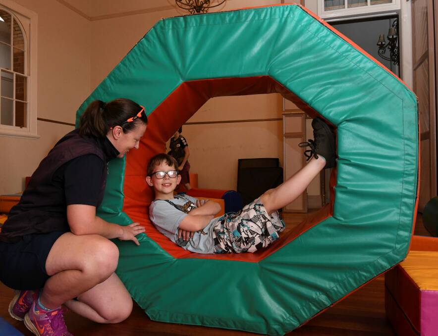 CHILDREN RETURN: Caleb, 9, and Bethany Taylor take a break from the fun during the Pinarc school holiday program. Picture: Lachlan Bence
