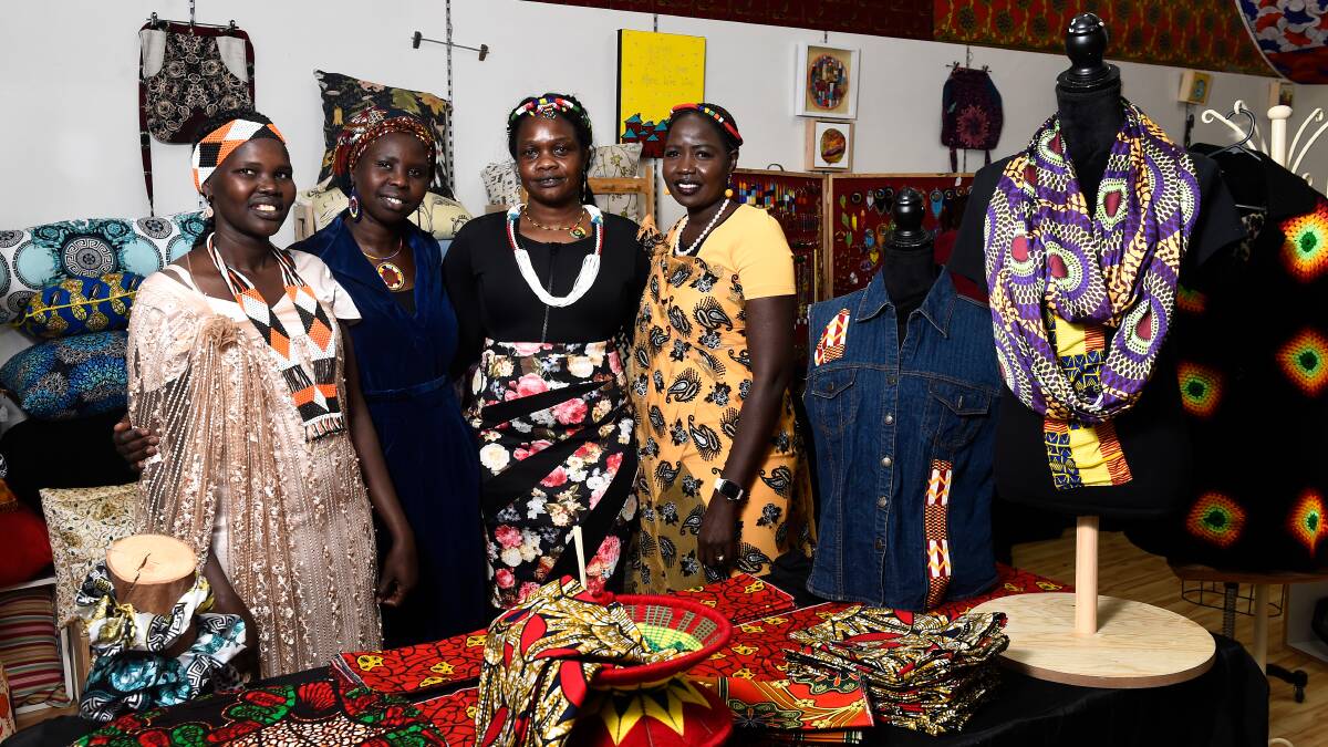  Mary Deng (Nyaluak), Nyibol Deng, Martha Chol, and Mary Top at the opening of Women of the Well in August 2023. Picture by Lachlan Bence