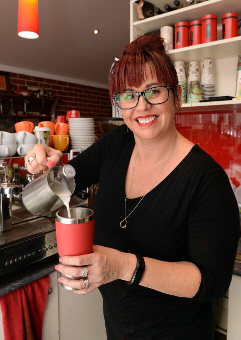 REFILLS: Sharine Shaw at Gove Cycles encourages customers to bring back their reusable cups to be refilled each time they visit. The keep cups save money for cafes, customers and help save waste going to landfill. Picture: Kate Healy 