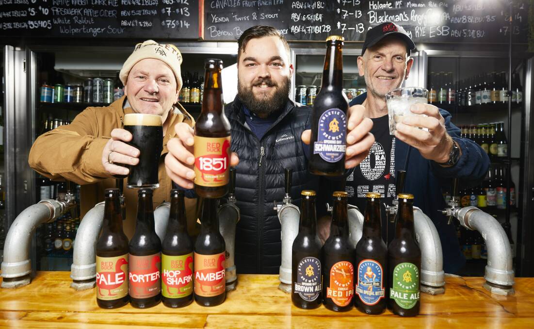 BREW: Athletic Club's Peter Parry, Hop Temple's Zac Hill and Red Duck/Kilderkin's Chris Pratt compare beers ahead of this weekend's Brew festival. Picture: Luka Kauzlaric