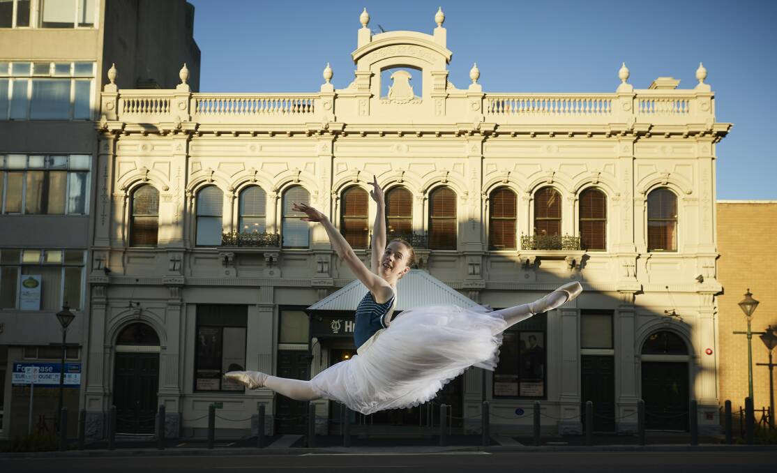 CONSERVATION: Alexandra Moore leaps outside Her Majesty's Theatre, which is closed for conservation works to extend the life of the 143-year-old venue. 