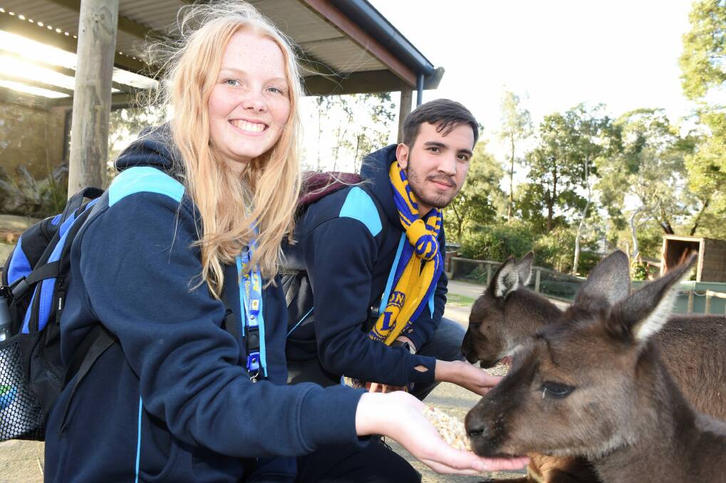MAKING FRIENDS: Sofie Boe Jensen (Denmark) and Max Charidi (Germany) make friends with the locals at Ballarat Wildlife Park.  Picture: Lachlan Bence
