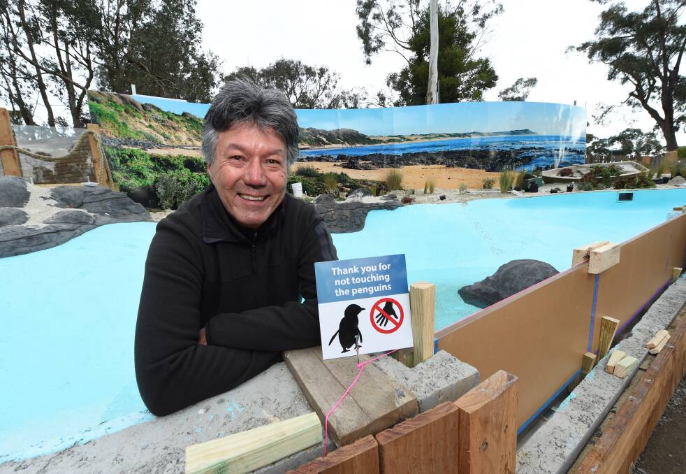 ALMOST THERE: Ballarat Wildlife Park owner Greg Parker checks final progress on the new penguin display, which will open tomorrow. Picture: Jeremy Bannister