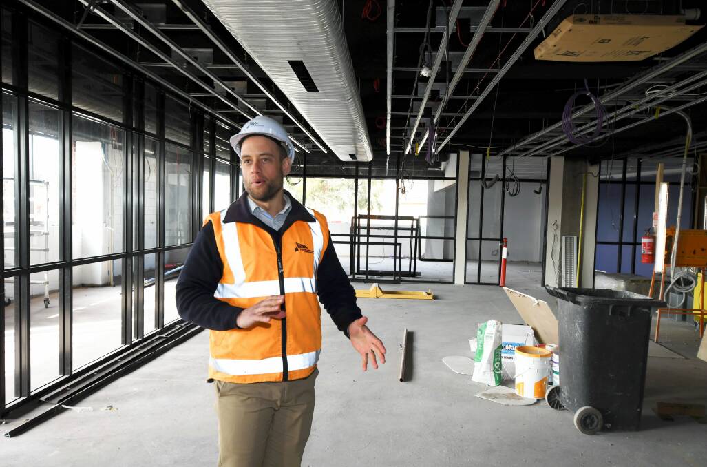 ON TRACK: Nicholson Construction project manager Stephen Allen explains the layout of classrooms and other spaces as he shows off construction progress on the new Ballarat Tech School. Picture: Lachlan Bence