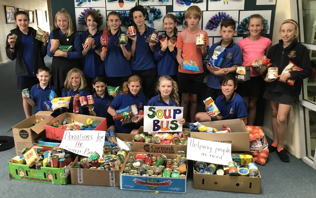 WELL-STOCKED: Pleasant Street Primary School junior school council members with some of the groceries donated for the Soup Bus. Picture: Michelle Smith
