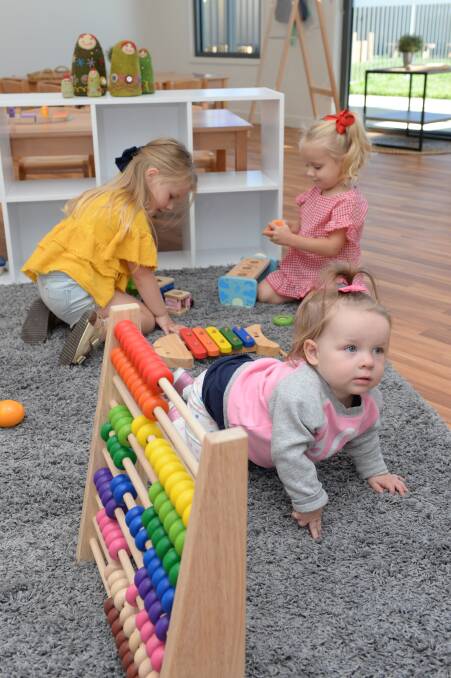 PLAYTIME: Indy, 4, Ruby, 3, and Zoe, 13 months, play with the new toys at the Brady Bunch Child Care Centre in Sebastopol ahead of its expected opening later this month. Picture: Kate Healy.