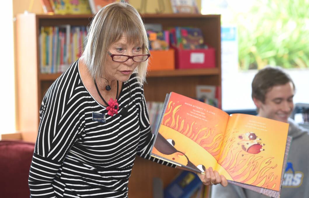 STORY TIME: Librarian Sandy Davey reads Tony Wilson's The Cow Tripped Over the Moon to an appreciative audience of about 50 children at Ballarat Library as part of National Simultaneous Storytime. Picture: Kate Healy