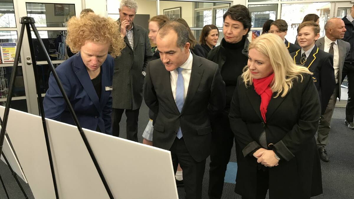 PLANS: Mount Rowan campus head Seona Murnane inspects redevelopment plans for the school with education minister James Merlino and Wendouree MP Sharon Knight. Picture: Michelle Smith 