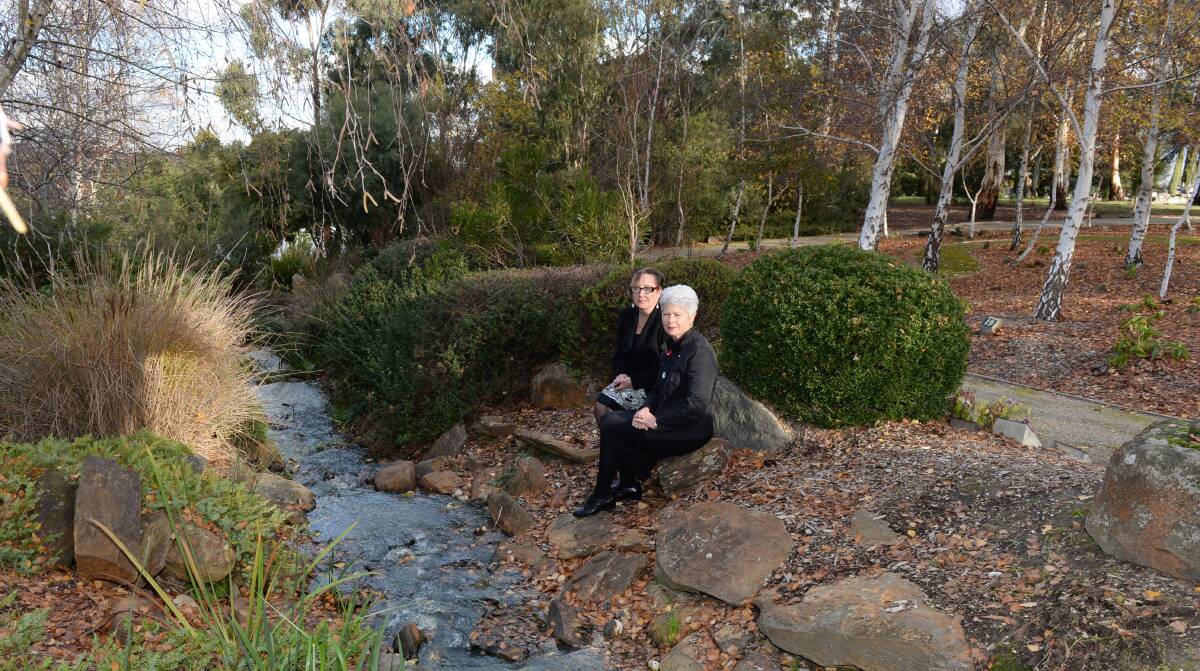 NATURE: Ballarat Cemeteries Trust chief Annie De Jong and chair Judy Verlin visit the Ballarat New Cemetery's Birdsong area, a quiet, natural setting where families can remember their loved ones with permanent memorials installed on rocks and other natural features. Picture: Kate Healy