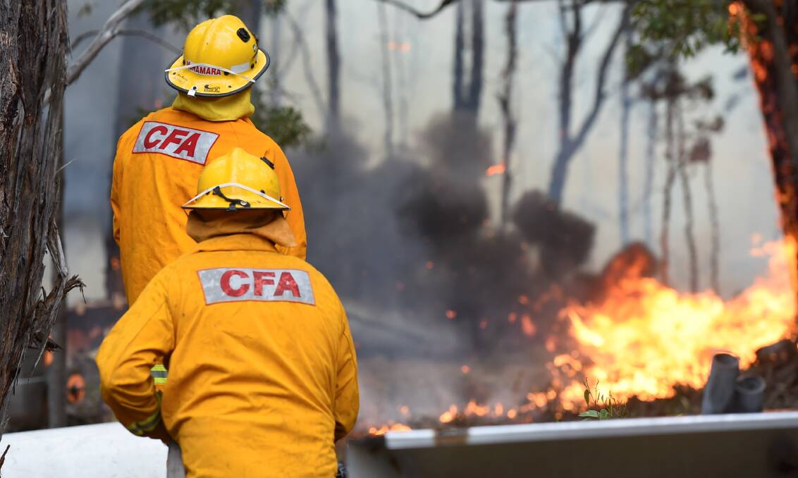 FIRE RISK: CFA volunteers battle the Scotsburn Bushfire in December, 2015 which burnt out 4000 hectares of land, 12 houses and dozens of other structures. Picture: Lachlan Bence