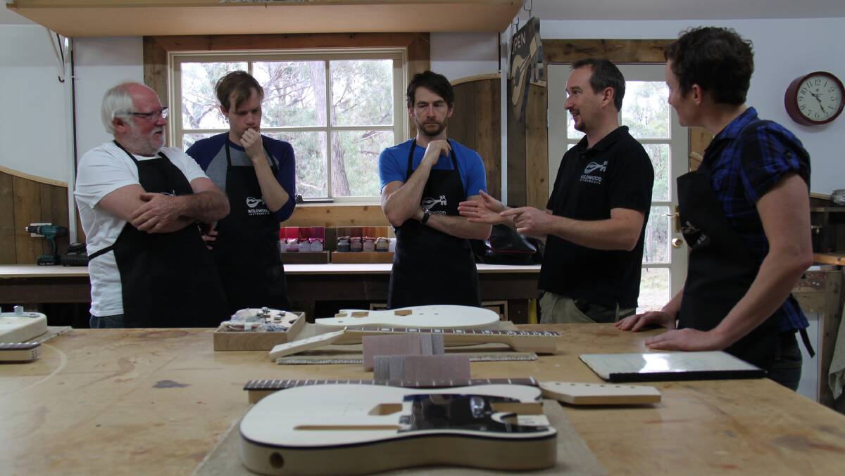 Precision: Luthier Nick Carpenter (second from right) has introduced a two-day course to teach musicians and music enthusiasts how to make their own personalised electric guitar. Picture: contributed
