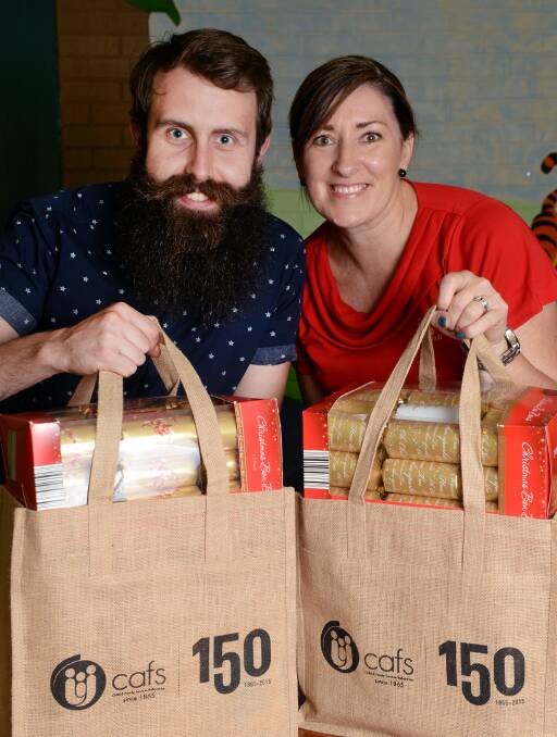 Christmas spirit: SJD Foundation director Brayden Dorney and Sovereign Hill manager of retail operations Nicole Roberts. Picture: Kate Healy