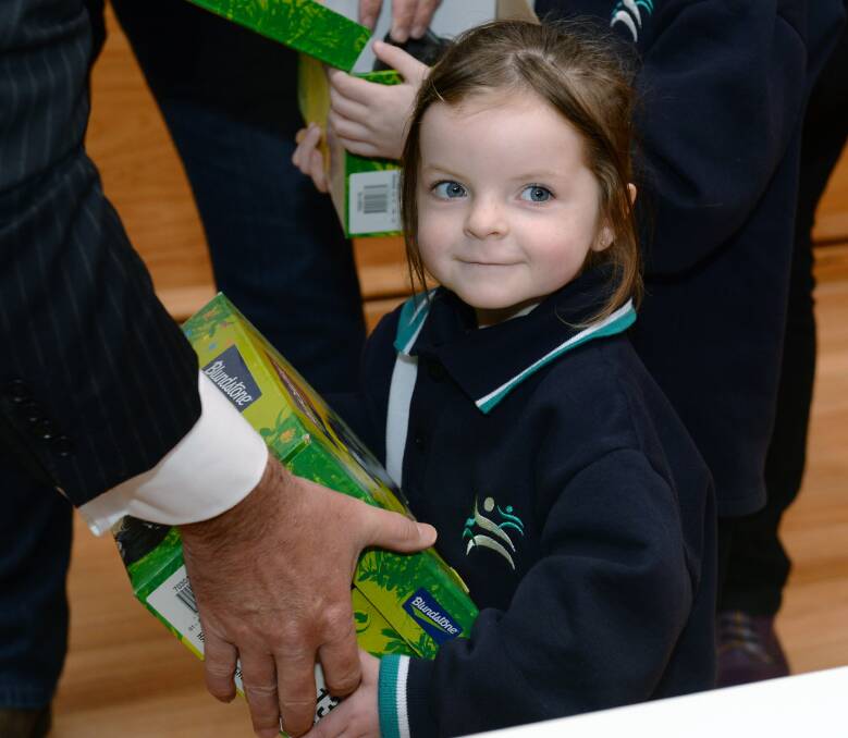 Sheer joy: Yuille Park Community College pupil Brooke (five) with her new pair of Blundstone shoes. Picture: Kate Healy