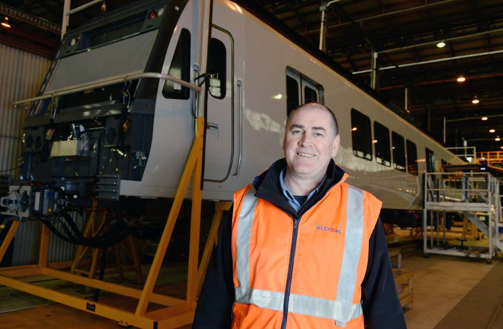 Milestone: Alstom Ballarat production manager Michael Selby with the 500th X'Trapolis carriage produced at the local factory. Picture: Kate Healy