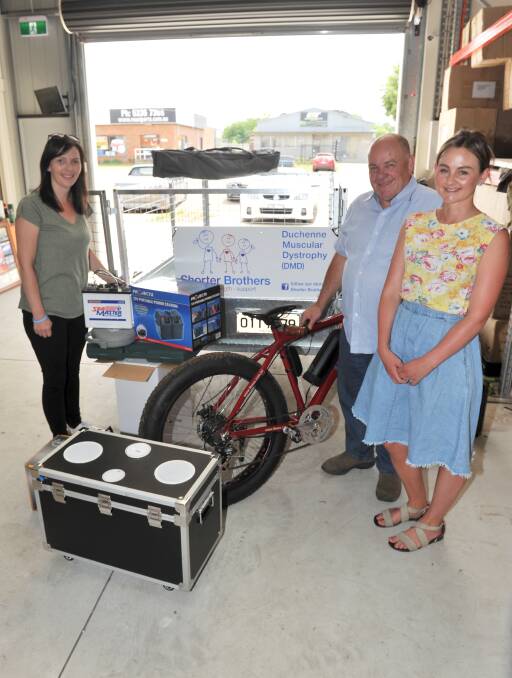 Get in quick: Rochelle Mitchell, Shane Gore and Annie Shorter with a sample of the items available at the Shorter Brothers Auction on Friday. Picture: Lachlan Bence