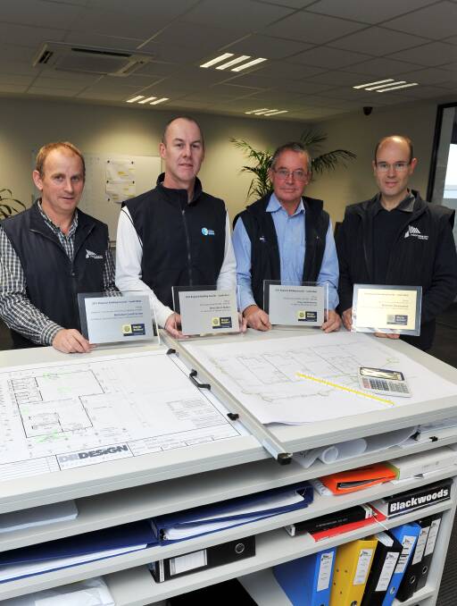 Strong planning: Geoff Pickering, Jamie Severino, Greg Smith and Richard Nicholson with their Master Builders Association awards. Picture: Lachlan Bence