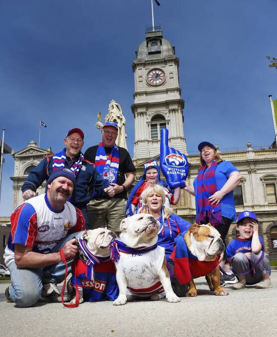 (Back) Ray Neville, Paul Tant, Damon Fry, Angela Fry, (front) Chris Templeton, Tanya Templeton and Harrison Del Rayne with bulldogs Cleo, Meeky and Harley.