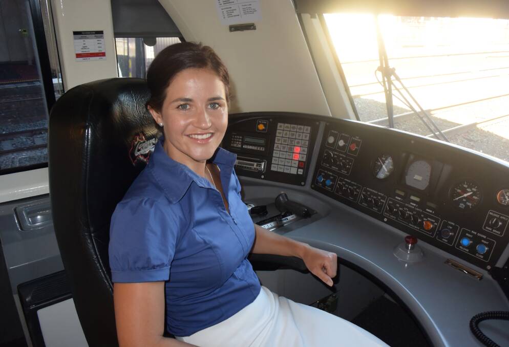 Honoured: Michelle Payne takes control of the new VLocity locomotive named in her honour.