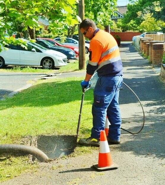 Central Highlands Water employees handle a minor leak in Errard Street North earlier in the week. Residents are encouraged to report leaks this summer.