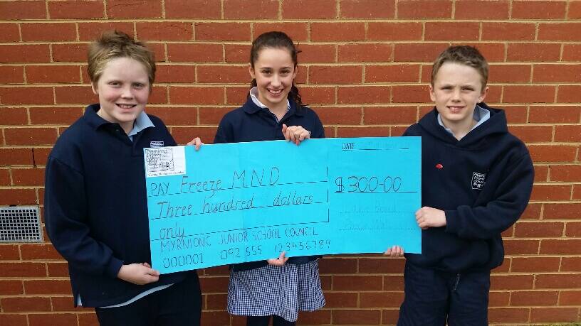 Jake Werneke (right), being presented with a cheque from Myrnion Primary School junior school council representatives Lockie Beard and Phoebe Wall.