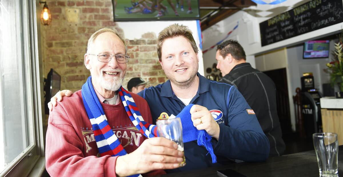 Red, white and blue: Father-son Western Bulldogs supporters Graham and Robert Allen. Picture: Luka Kauzlaric
