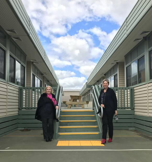 Wendouree MP Sharon Knight and Ballarat Specialist School principal Kim Yearwood with the portables set to receive permanent shading through a new state government grant.