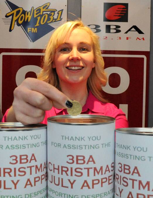 making a difference: Jules Zass with 3BA's Donate a Dollar Day collection tins. Picture: Lachlan Bence