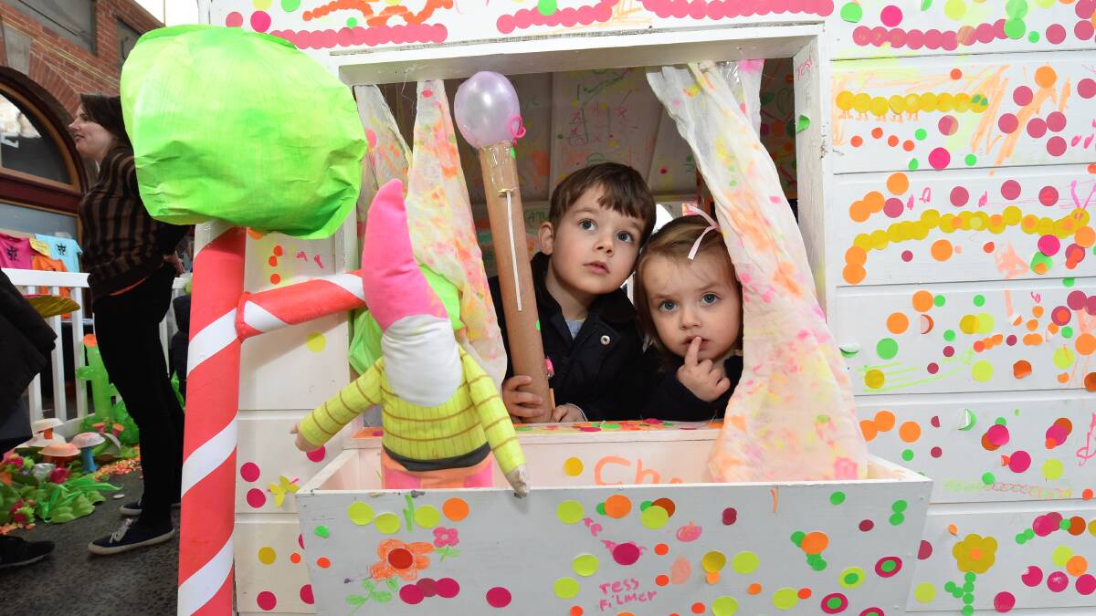Sam and Maddie Werne enjoying the cubby house at the Rug Up Festival.